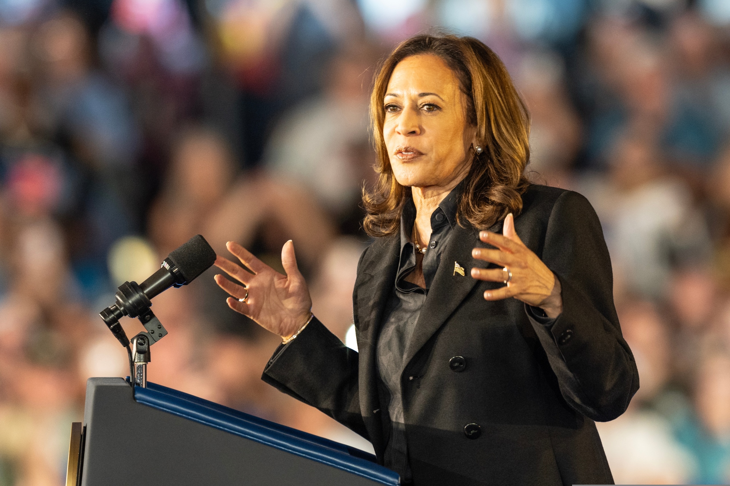 Kamala Harris speaking at a podium