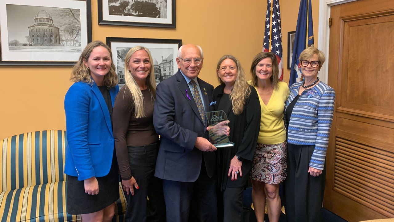 ANCOR members and ANCOR staff posing with U.S. Representative Paul Tonko (D-NY) after presenting him with the association's 2024 Congressional Champion Award.